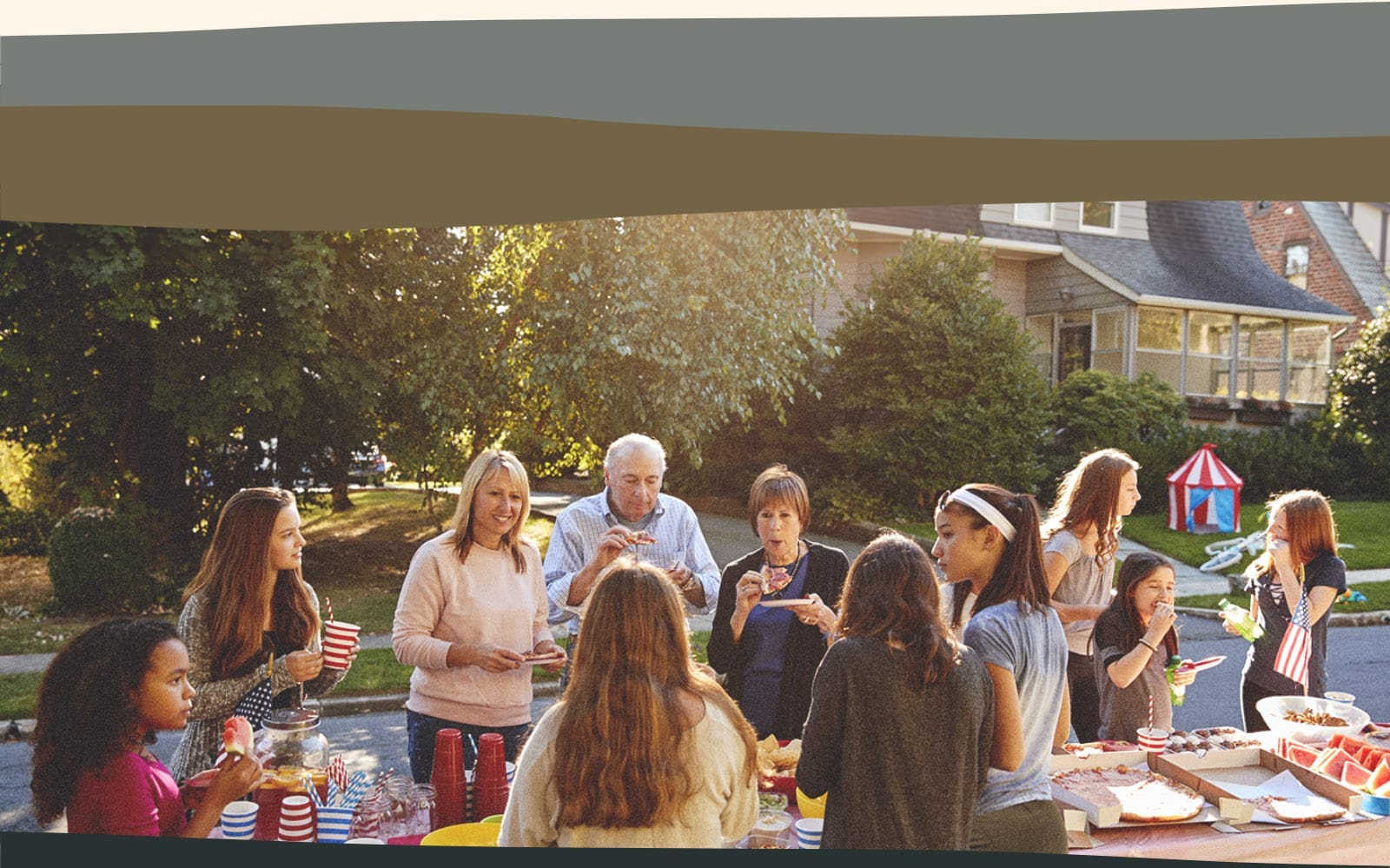 neighbors eating outside in suburban neighborhood