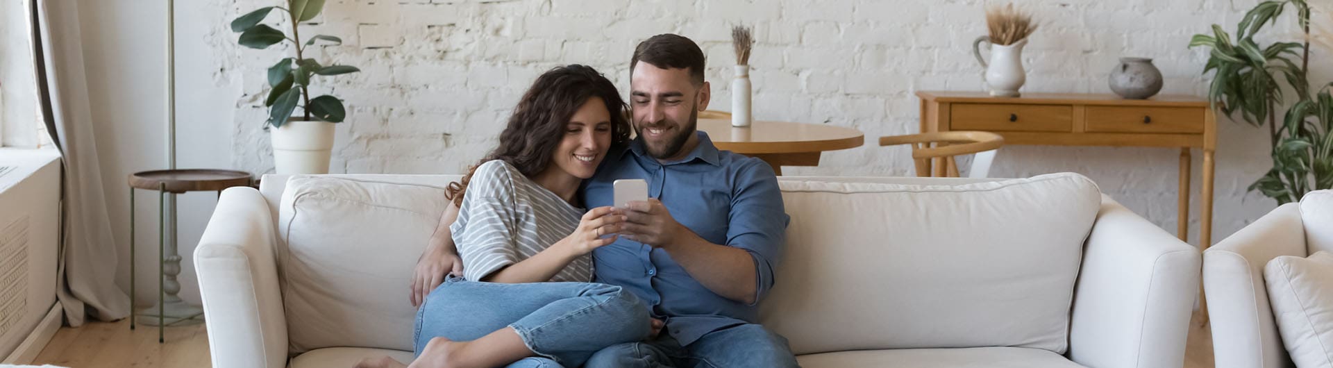 man looking at mobile web design on phone