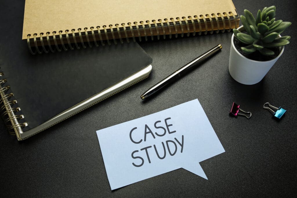 case study written in speech bubble on black office desk. Writing a B2B case study